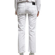 The back view of a pair of low-rise straight leg jeans is shown against a white background. The jeans feature a white base wash with prominent vertical cracks, giving them a distressed appearance.