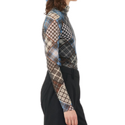 Graphic print mesh turtleneck modeled against white background. side view
