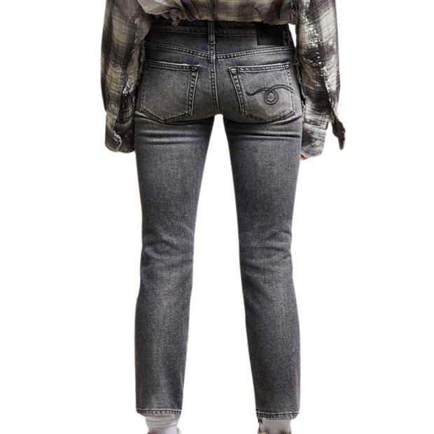 The back view of a pair of low-rise dark grey/black straight jeans is displayed against a white background. The image shows the jeans from the waist to the ankles, highlighting two back pockets. The jeans have a dark grey or black wash, providing a stylish and modern look.