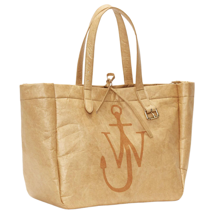 "Image: A side view of a tan tote bag, showcasing its elegant design and spacious interior. The bag features sturdy handles and a smooth, structured silhouette. The tan color adds a touch of sophistication, making it a versatile and fashionable accessory for any occasion."