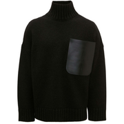 Image: A turtleneck sweater made of leather, featuring stylish patch pockets. The sweater has a sleek and modern design, with a high neck and long sleeves.