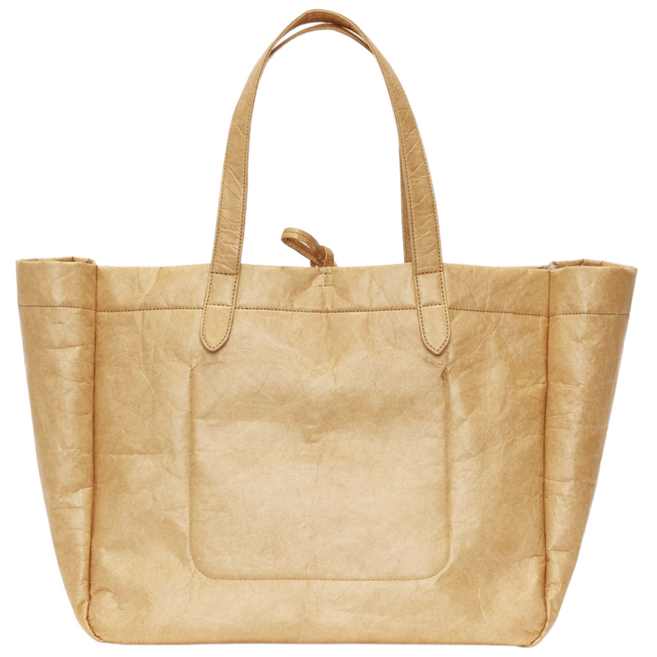 Image: A back view of a tan cotton felt tote bag, highlighting its simple and elegant design. The bag features a clean and seamless back panel, showcasing the smooth texture of the cotton felt material. The neutral tan color adds a timeless and versatile touch to this stylish accessory