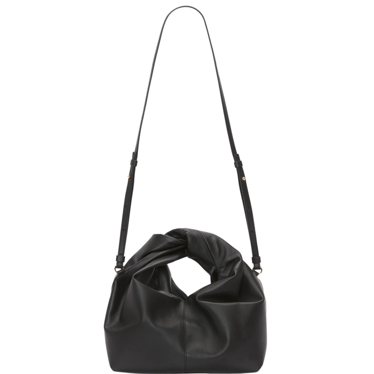 Image: A stylish leather hobo bag with a convenient crossbody strap, presented against a neutral background. The bag showcases a spacious main compartment, crafted from high-quality leather for a luxurious look and feel. The crossbody strap allows for comfortable and hands-free carrying, making it a versatile and practical accessory.