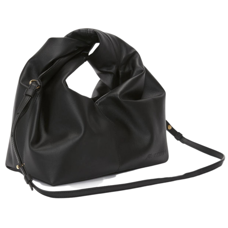 "Image: A stylish leather hobo bag with a convenient crossbody strap, presented against a neutral background. The bag showcases a spacious main compartment, crafted from high-quality leather for a luxurious look and feel. The crossbody strap allows for comfortable and hands-free carrying, making it a versatile and practical accessory."