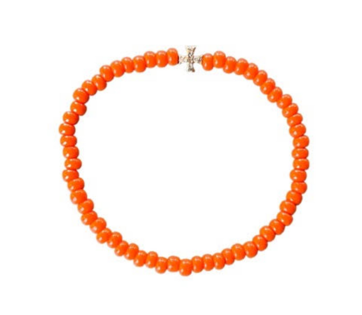 Bright orange bead bracelet with gold diamond cross